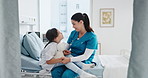 Woman, nurse and holding hands with child in hospital for reassurance, medical support and surgery. Healthcare worker, talking and kid with teddy bear for emotional comfort, guidance and treatment