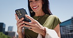 Phone, hands and businesswoman in city for communication, typing or email on mobile app. Technology, laughing and female corporate employee with cellphone for texting, social media or online in town.