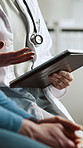 Tablet, hospital and hands of doctor with patient for research on medical diagnosis or treatment planning. Digital technology, professional and healthcare worker with person for discussion in clinic.