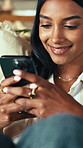 Phone, relax and typing with woman in home living room for internet or social media browsing. App, smile and text message with happy Indian person in apartment for communication or me time wellness