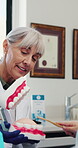 Woman, child or brushing teeth model at dentist for oral education, cleaning practice or how to. Doctor, mature person or teaching girl with toothbrush for interactive lesson or learning mouth health