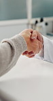 People, doctor or handshake with patient for consultation, thank you or healthcare visit in clinic. Closeup, client and shaking hands with medical worker for agreement, health checkup or service