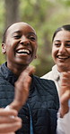 Smile, women and volunteer with applause in park for good news with charity success. Happy, people and clapping hands for community service goals, fundraising achievement and team motivation outdoor