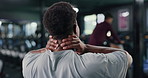 Back, man and discomfort with neck pain at gym from fitness injury, muscle strain and ache. Male person, cramps and joint inflammation from workout accident, exercise mistake and fibromyalgia sprain