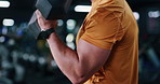 Bicep, dumbbell and fitness with man in gym for strength training or workout routine. Arm, exercise and intensity with bodybuilder weightlifting in health club for physical challenge or resilience