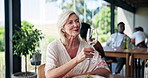 Mature woman, wine tasting and drink with glass in restaurant for romantic date or vineyard venue. Female person, customer and smile with cheers or toast for fine dining, alcohol or anniversary