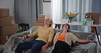 New home, tired and couple with sofa for moving to dream house, property purchase and apartment. Marriage, homeowner and man with woman rest with furniture for relocation, mortgage and real estate