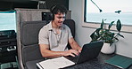 Headphones, laptop and man in rv for travel blog, remote work and copywriting for digital nomad. Freelancer, van and happy person with music, audio and computer for tourist guide, road trip or review