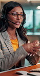Business woman, agent and typing with headset for online advice or consultation at call center. Glasses, consultant and help or explanation on computer for customer service or tech support in office