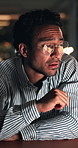 Tired, man and wake up in office at night with glasses, editing break and overworked on story. Publishing agency, exhausted journalist and yawn with bokeh from low energy, narcolepsy or news deadline