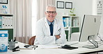 Doctor, mature man and face for healthcare in office with paperwork for medical admin or online consulting. Person, medicine expert and portrait in clinic with confidence, technology and service
