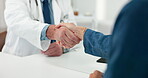 Doctor, patient and handshake in office with appointment for medical assistance, advice and welcome. Healthcare worker, people and shaking hands in consultation for greeting, introduction and help.