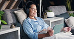 Woman, tablet and drip therapy in lounge, relax or headphones with saline solution for immune system boost. Person, tech and iv for wellness benefits, vitamin or mineral infusion with smile on app