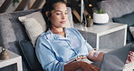 Woman, laptop and iv drip in lounge, relax or typing with saline solution for immune system boost. Person, computer and medical therapy for benefits, vitamin or mineral infusion with social media