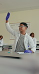Teenager, student and hand raised in chemistry class for education, participation and questions. Boy, learner and gesture for attention, science feedback and opinion for experiment solution of lesson