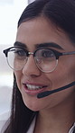 Woman, happy and mic at call center with glasses, problem solving and customer service at office. Person, consultant or agent with voip tech, smile and contact us for solution with headset at company