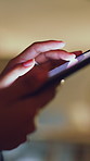 Hands, phone and scrolling with business woman in office at night for social media browsing. App, fingers and internet search with employee person in dark workplace for communication or research