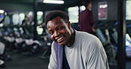 Water, drinking and face of black man at gym for break with workout, training or health with sweating. Fitness, portrait and African person with drink and towel for exercise recovery in sports center
