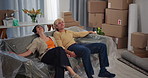 New home, sofa and couple rest for moving to dream house, property purchase and apartment. Marriage, homeowner and tired man with woman relax with furniture for relocation, mortgage and real estate