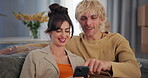 Happy, couple and planning with phone in new home for online shopping, furniture app and moving in. Relocation, people or discussion with smartphone on sofa for interior design or renovation decision