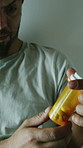 Psychology, mental health and man with pills in rehab for schizophrenia, bipolar disorder and treatment. Healthcare, facility and person with medicine, medication and tablets for medical condition