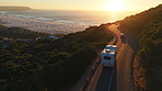 Travel, road trip and drone with van for adventure, transportation and summer vacation. Holiday destination, sunset view and motor vehicle driving in nature for journey, exploration and weekend