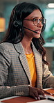 Business woman, agent and talking with headset for online advice or consultation at call center. Glasses, consultant and explanation on computer for customer service or tech support in office