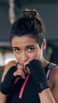 Woman, face and gloves for combat sports in gym with training, confidence with technique for fight. Person, athlete and portrait with martial arts, exercise and workout in fitness club with boxer