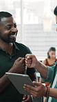 Men, tablet and fist bump with success at startup, support and motivation for project with coworking. People, team and excited with tech, application or celebration for goals at creative agency