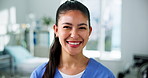 Face, nurse and happy woman in clinic for medical career, about us and confidence in icu. Portrait, person and healthcare worker with smile in hospital, pride and wellness with critical care surgeon