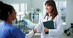 Shaking hands, partnership and doctor with nurse in hospital for medical consultation planning. Discussion, handshake and healthcare employees with welcome, thank you or support together in clinic.