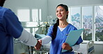 Handshake, doctors and happy woman with folder in hospital, medical team and welcome new colleague. Partnership, healthcare and people shaking hands for future collaboration, support and introduction