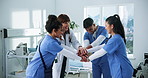 Clinic, nurses and doctor with hands together for huddle, teamwork or motivation in hospital. People, employees or healthcare professionals with stack for medical solidarity, collaboration or support