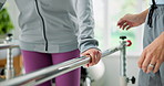 Elderly woman, hands or walking with physiotherapist on rail for balance, mobility or healthcare. Senior, female person or physio helping patient with movement, steps or motion for recovery in clinic