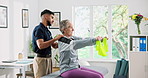 Medical, resistance band and physical therapist with senior woman in clinic with recovery. Healthcare support, arm exercise and physiotherapist with elderly female patient for muscle movement.
