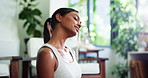 Fitness, meditation and stretching with woman in living room of home for start of yoga routine. Exercise, holistic health and shoulders with person getting ready for awareness or mindfulness session