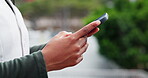 Hands, typing and employee with smartphone, city and communication for real estate update on website. Outdoor, realtor and person with mobile for message, online and network with contact for schedule