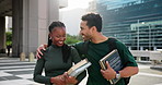 Happy people, student and hug with books in city for education, learning journey or travel. Man, woman or academic learners with textbooks or smile for friendly study vibe or growth in an urban town