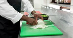Hands, chef and cut onions in restaurant for meal prep, culinary process or catering in food industry. Hospitality, person and vegetables in kitchen for fresh ingredients, cuisine production and cook