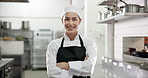 Face, confident chef and happy woman in kitchen for catering, gastronomy and pride in restaurant. Portrait, smile and culinary artist with arms crossed, professional cook and hospitality in Italy