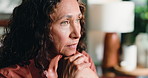 Reflection, sad and mature woman in home with loneliness, stress or remember past with regret. Thinking, depression and person in living room with anxiety for mental health, nostalgia and flashback