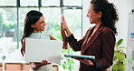 High five, laptop and tablet with business women in office for internship or project management. App, computer or success with design employee and mentor in workplace for bonus, goals or target