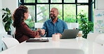 People, smile and handshake in office with laptop for marketing agreement, statistics or data analysis. Shaking hands, mature man and woman in workplace with computer, advertising approval or graphs.