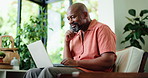 Black man, thinking and reading in home with laptop for remote work, marketing proposal or idea. Mature person, plan and typing with computer in house for freelance advertising, research and insight.