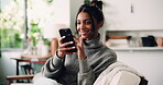Phone, smile and typing with woman on sofa in living room of home for social media browsing. App, scrolling and search with happy Indian person in apartment for communication, planning or texting