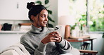 Phone, smile and vision with woman on sofa in living room of home for social media browsing. App, scrolling and thinking with happy Indian person in apartment for ideas, planning or typing message
