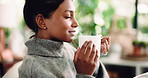Smile, woman and smell coffee at house for peace, enjoy caffeine aroma and calm morning in lounge. Female person, breathing and warm beverage for scent, espresso fragrance and weekend break on couch