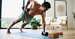 Man, fitness and weightlifting with dumbbells in home for exercise, muscle gain or training. Active, muscular or male person with equipment or weights for arm workout or renegade row on mat in house