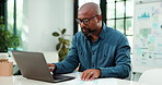 Business, black man and laptop with document in office for research, finance report and data analysis. Person, pc and graphs with paperwork for financial stats, profit comparison and kpi performance