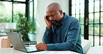 Fatigue, laptop and stress with business black man at desk in office for planning, report or research. Burnout, computer and tired with mature employee in workplace for review of charts of graphs